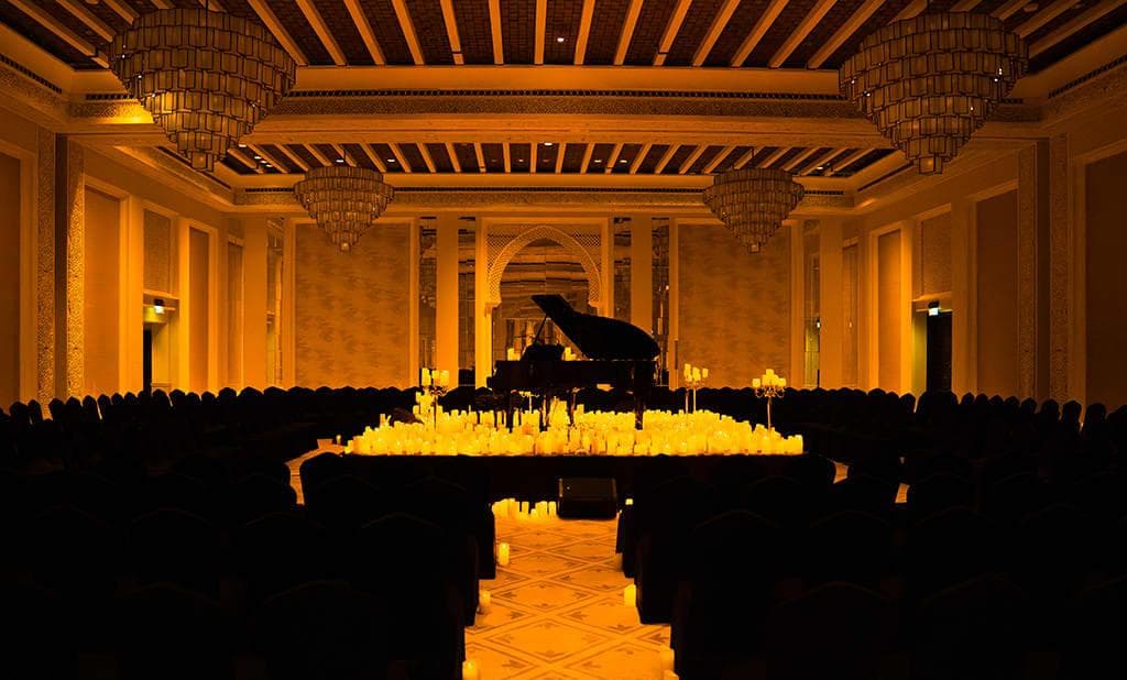 The elegant Candlelight concert venue at Madinat Jumeirah, illuminated by hundreds of glowing candles.