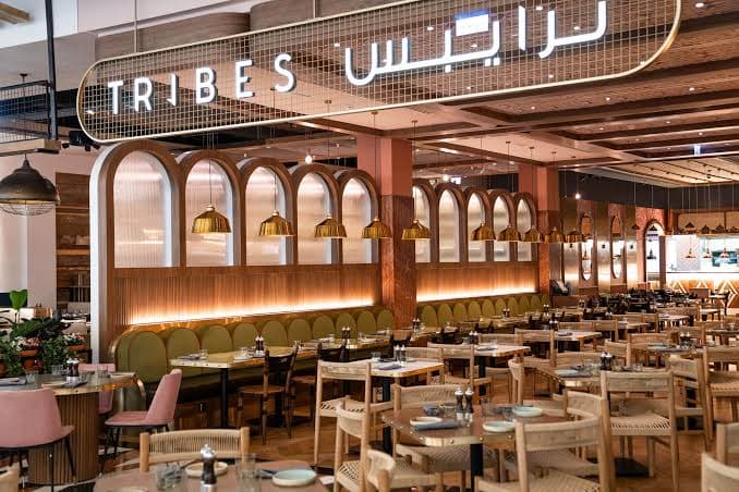 Elegant interior of Tribes restaurant at Mall of the Emirates Dubai, offering a stylish dining atmosphere and comfortable seating.