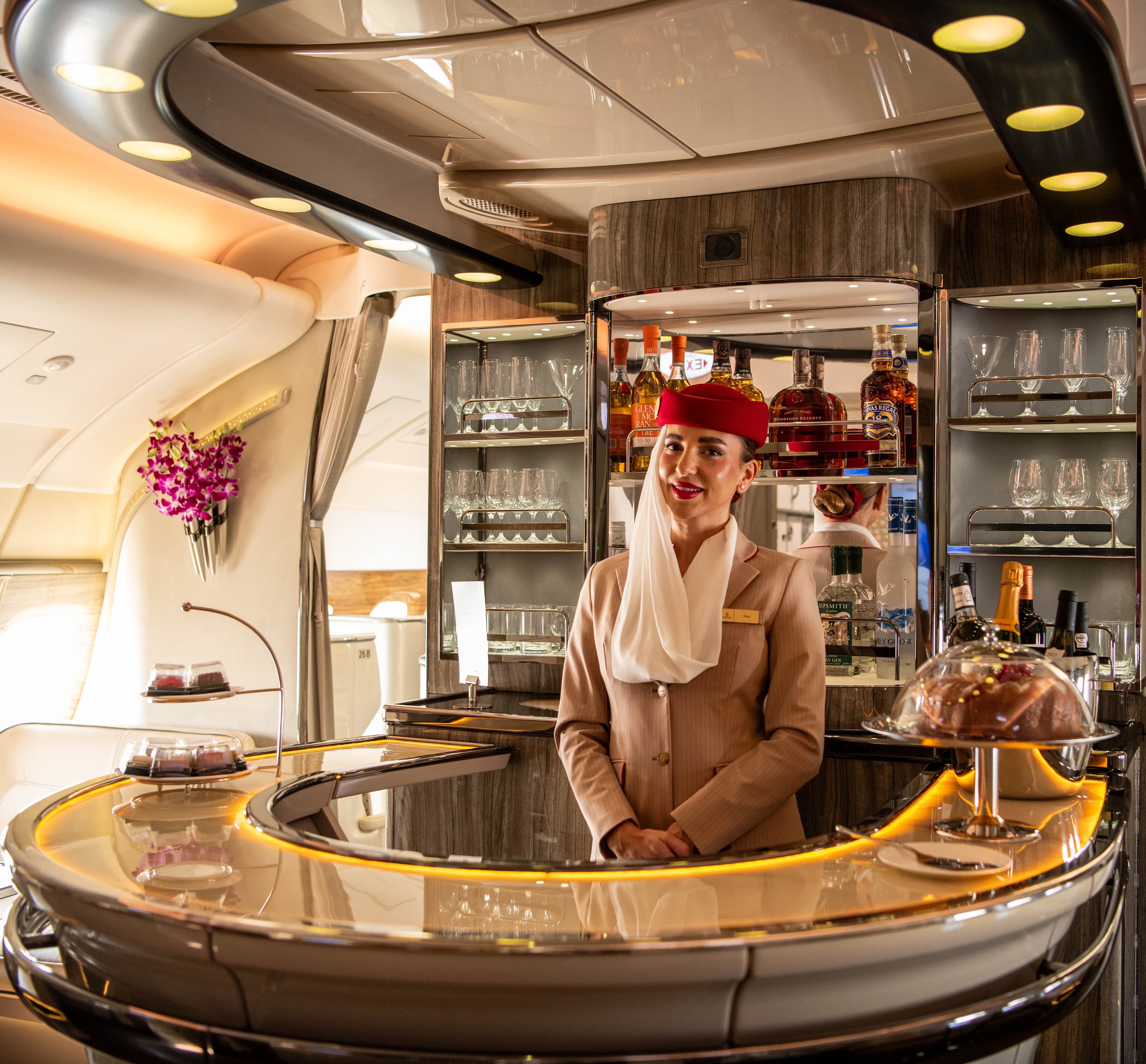 Emirates A380 Business Class onboard bar lounge served by multilingual cabin crew representing over 130 nationalities