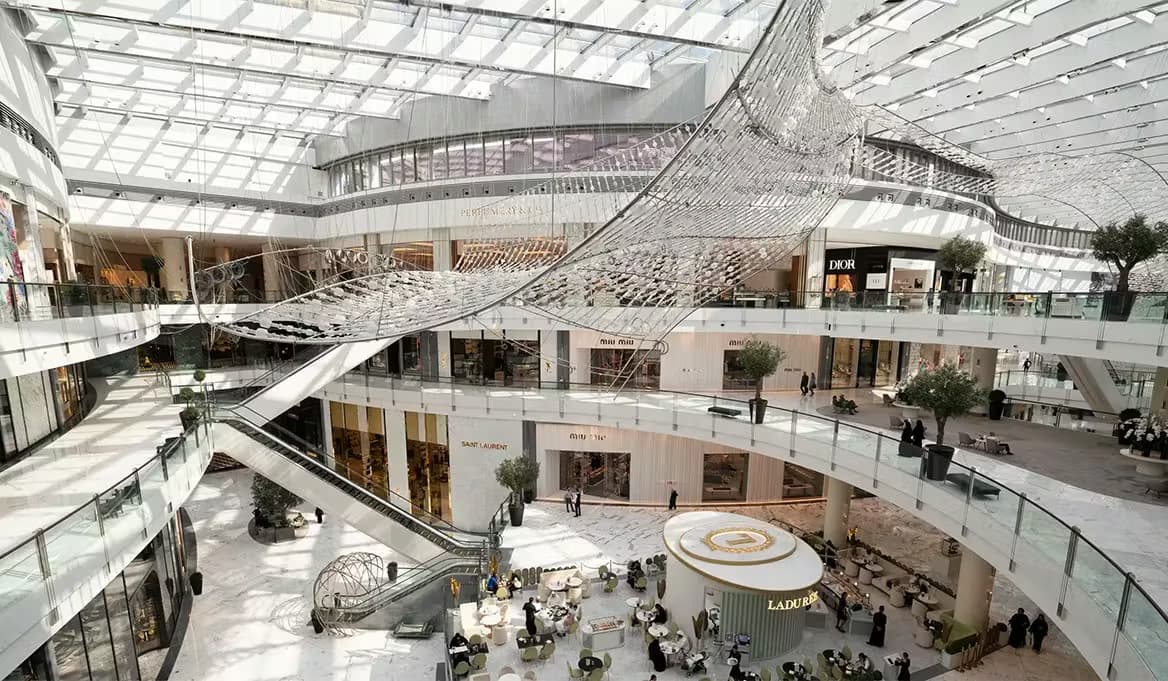 Fashion Avenue interior atrium at The Dubai Mall with luxury brands Dior and Miu Miu on multiple floors