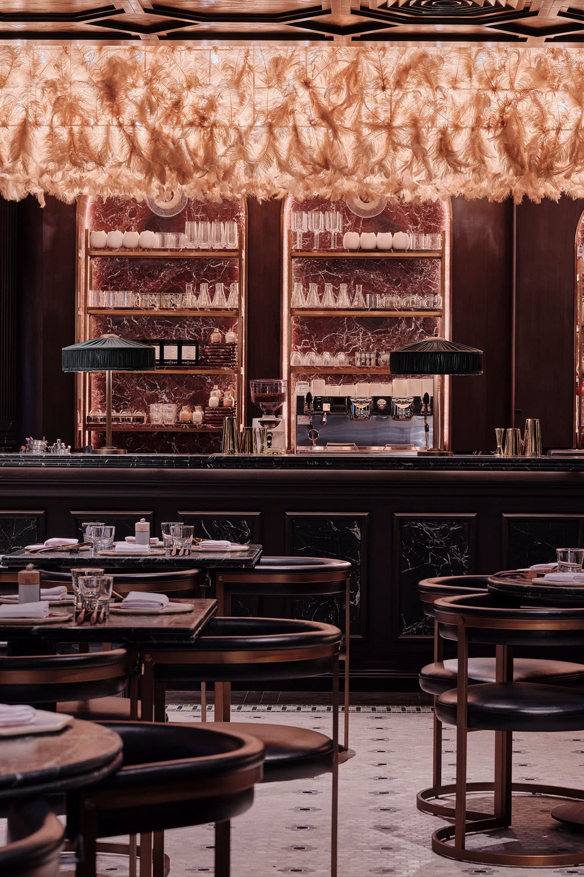 Elegant luxury interior bar with feather ceiling decor at The Meat Co Souk Madinat Jumeirah Dubai