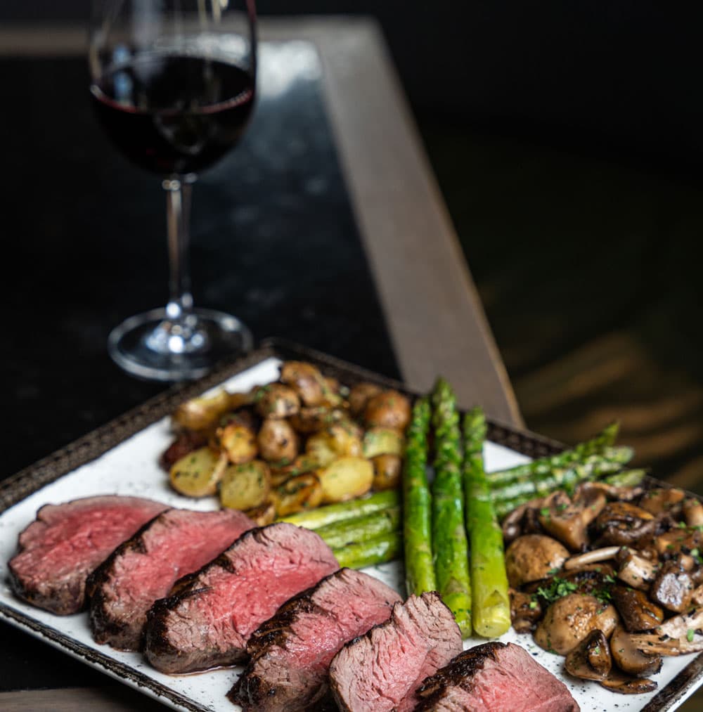 Grilled beef fillet with asparagus, mushrooms, and red wine at The Meat Co Dubai steakhouse