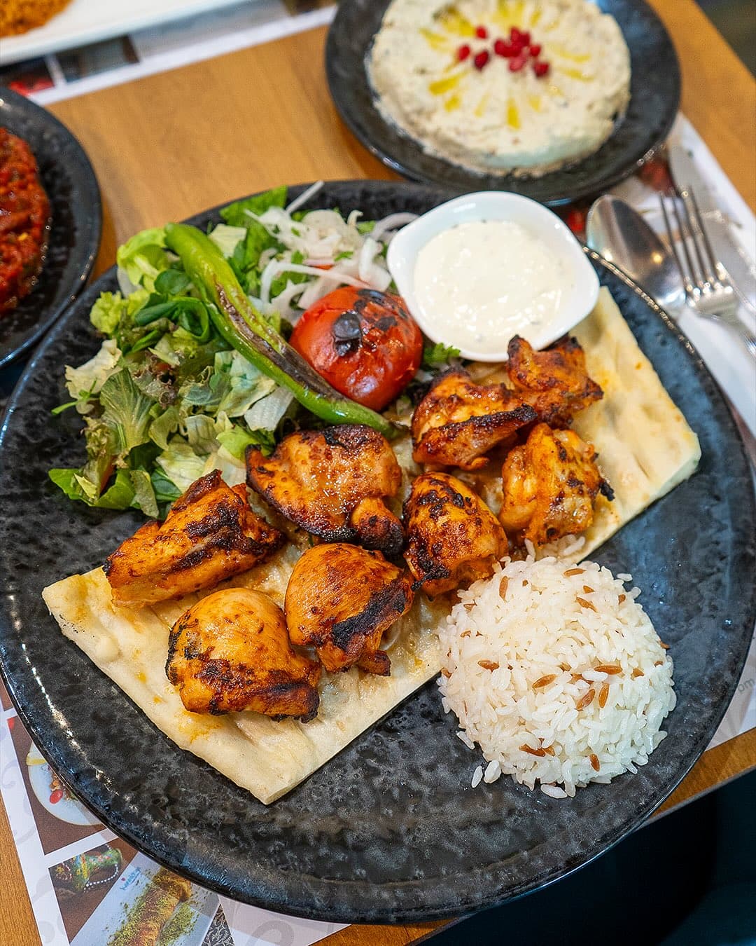 Grilled chicken shish kebab with rice and salad at Kapadokya Turkish Kitchen Dubai Sheikh Zayed Road