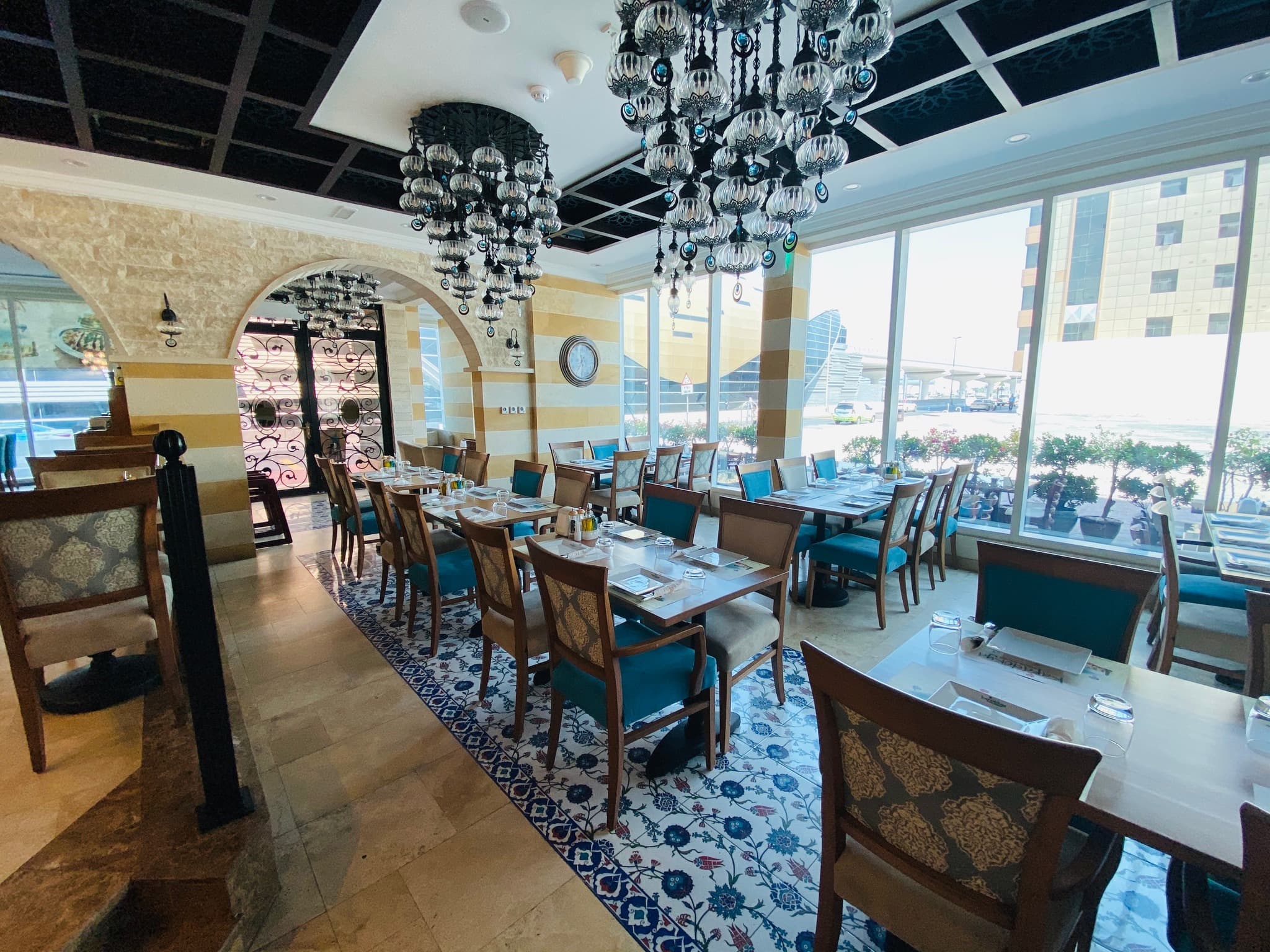 Elegant Ottoman-style interior dining area with Turkish chandeliers at Kapadokya Turkish Kitchen Al Barsha Dubai