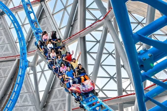 The Storm Coaster at Dubai Hills Mall, featuring an exciting indoor roller coaster with blue tracks and passengers enjoying the ride.