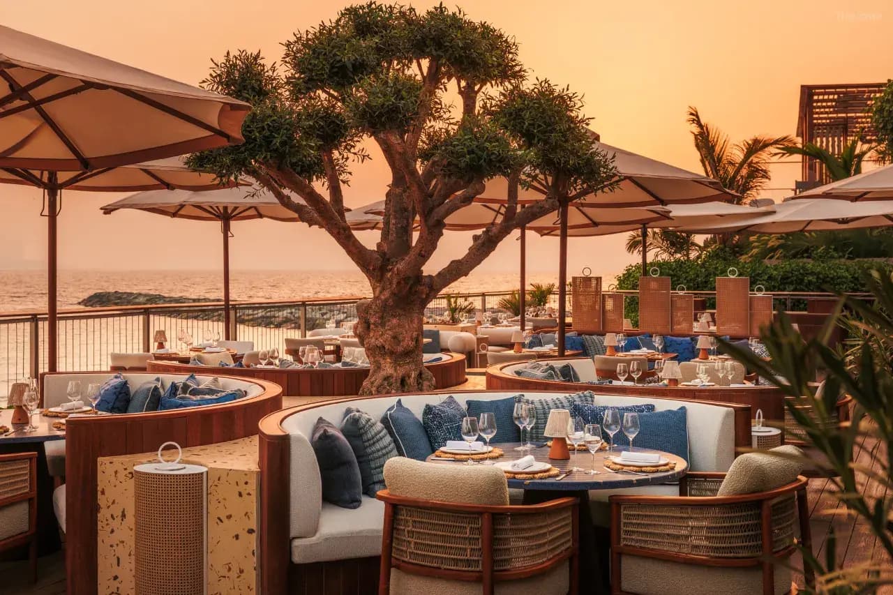 An evening dinner atmosphere inside the hotel, featuring luxury seating perfect for sipping wine.