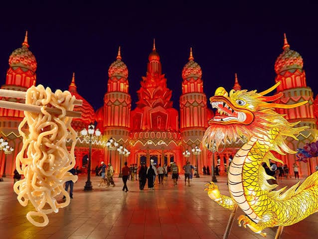 A colorful cultural pavilion featuring a spectacular dragon decoration and vibrant nighttime lights.